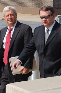 Kevin Lewis, right, with attorney Tim Dudley, enter U.S District Court in Little Rock on Wednesday.