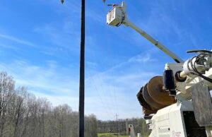 An Arkansas Electric Cooperative Corp. member utility works as part of the clean up efforts after tornadoes tore through Arkansas on March 31.