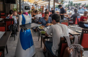 A waiter robot brings orders to diners at the Gran Caff&egrave; Rapallo restaurant in Italy in 2019