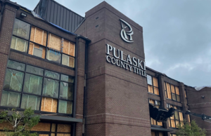 Windows are boarded up at the offices of Pulaski County Title Co. of Little Rock, which suffered damage in the March 31 tornado.