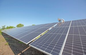 Austin Taylor, an installer with Delta Solar of Little Rock, performed maintenance tasks last week on an array that provides 10% of the power used by the city of England.