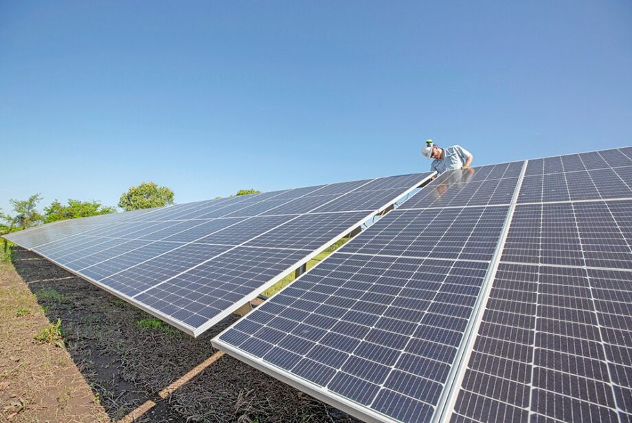 Austin Taylor, an installer with Delta Solar of Little Rock, performed maintenance tasks last week on an array that provides 10% of the power used by the city of England.