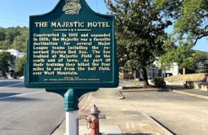 A historic marker at the site of the Majestic Hotel, which was destroyed by fire in 2014.