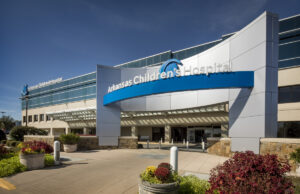 The entrance to a multistory glass building