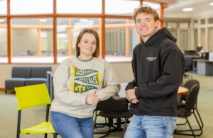 Arkansas Tech University seniors Mandy Hughes and Cogan Hester have navigated college without student loans. [Daniel Moody]