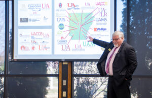 Northark President Rick Massengale with a map of all campuses affiliated with the University of Arkansas System. [PHOTO provided]