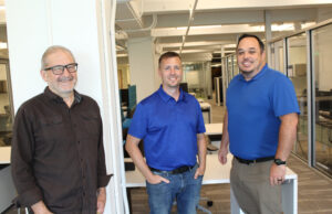 From left, Mike Steely, chief revenue officer, Scott Roper, vice president of business development and COO; and Nathan Myers, CEO and president, all from AccuCode AI Inc. [Mark Friedman]