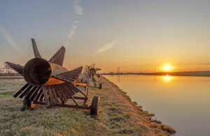 One of Keo Fish Farms’ 100 different fish ponds. The farm produces mostly hybrid striped bass and triploid grass carp, as well as smaller numbers of other breeds like catfish and crappie. (Photo provided)