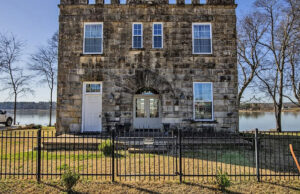 A 1914 jailhouse in Ozark on the Arkansas River has been renovated and is back on the market as a home. [PHOTO provided]