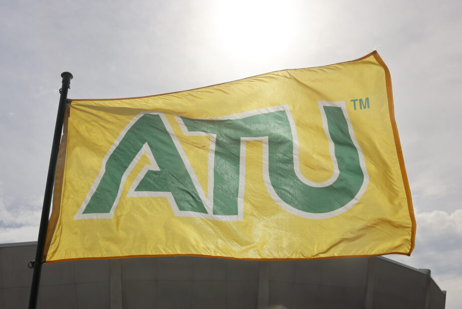 A yellow flag on a flagpost states ATU in green block font