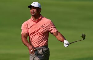 Tiger Woods swinging a golf club on a golf course