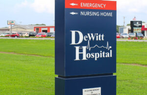 A photo of the DeWitt Hospital sign outside the hospital.