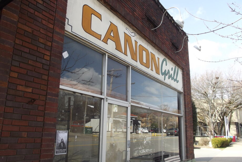 A close-up image of the restaurant space that used to be Cañon Grill, the signage is still there, but the building is empty.