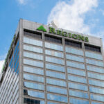 An angled photo of the Regions Center in Little Rock, a 30-story skyscraper with a grid of windows on every side.