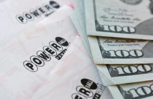 Powerball lottery tickets and $100 bills