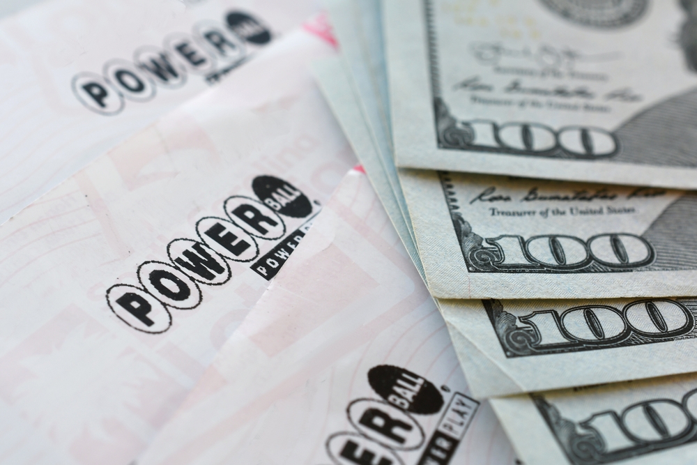 Powerball lottery tickets and $100 bills